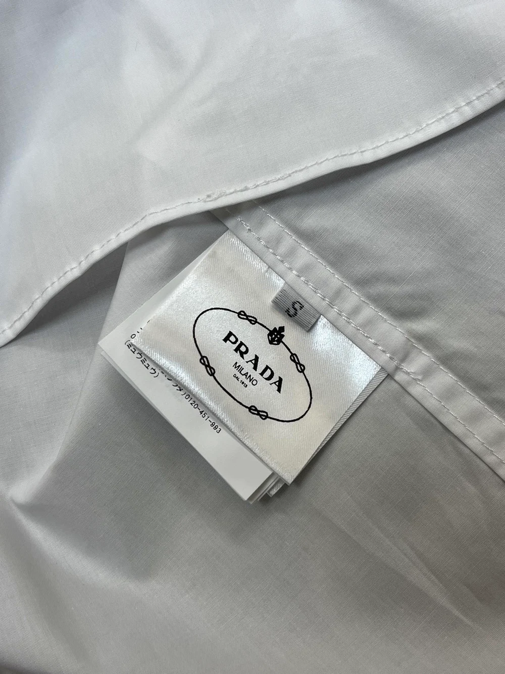 프라다 리포터 매그넘 셔츠